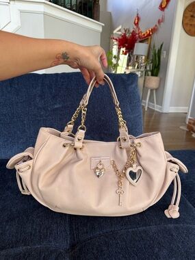 Juicy Couture beige trending bag.